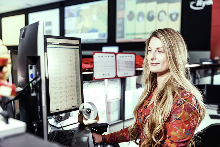 Ryder employee managing the transportation of good from a centralized control tower