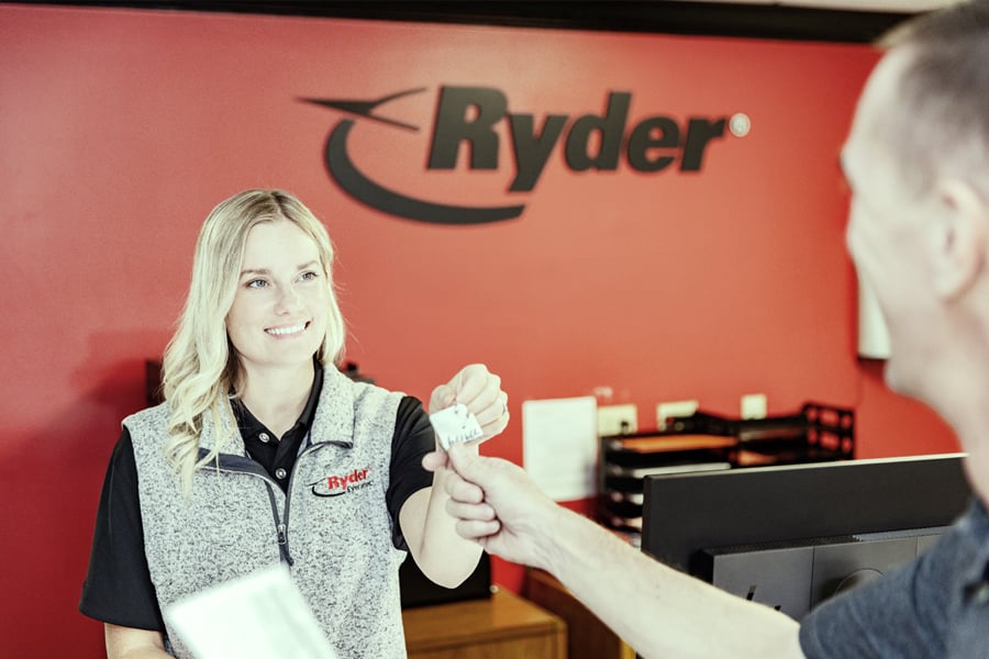 Ryder rental agent passing off truck keys to a customer