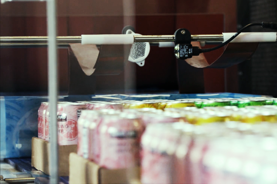 beverages being packaged on a beverage manufacturing assembly line